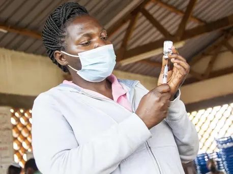 n Uganda on October 19, 2021, Mary Namirembe, a nurse at Masaka Regional Referral Hospital, fills a syringe with COVID-19 vaccine. n Uganda on October 19, 2021, Mary Namirembe, a nurse at Masaka Regional Referral Hospital, fills a syringe with COVID-19 vaccine.