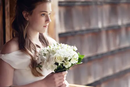 Girl in White Dress with Flower Bouquet
