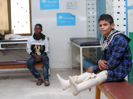 After losing his legs in a landmine explosion, Ibrahim, 17, received artificial limbs and learned to walk again at a UNICEF-supported prosthetic center in Aden, Yemen. After losing his legs in a landmine explosion, Ibrahim, 17, received artificial limbs and learned to walk again at a UNICEF-supported prosthetic center in Aden, Yemen.