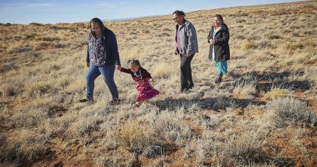 Three generations of a family, citizens of the Navajo Nation, are photographed in Central Chinle Agency in Arizona.