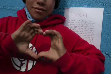 A boy reacts to a letter of support he received from another Mexican teenager at a shelter for unaccompanied migrant adolescents in Tijuana, Mexico. A boy reacts to a letter of support he received from another Mexican teenager at a shelter for unaccompanied migrant adolescents in Tijuana, Mexico.