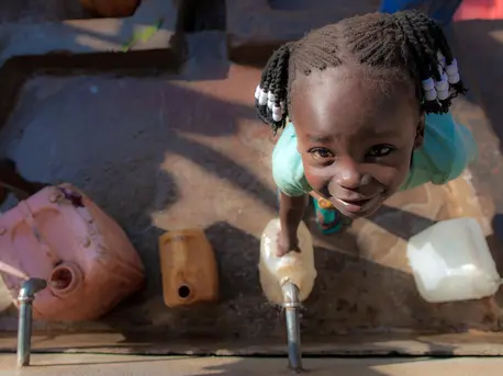 Five-year-old Queen Philip collects water at a UNICEF-supported water point in Yambio, South Sudan. Five-year-old Queen Philip collects water at a UNICEF-supported water point in Yambio, South Sudan.