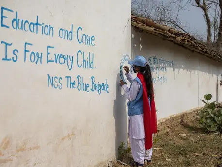 Person Painting a Mural