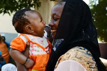 A mother with her four month old baby in Cameroon during a UNICEF nutrition activity for moms and their children. A mother with her four month old baby in Cameroon during a UNICEF nutrition activity for moms and their children.