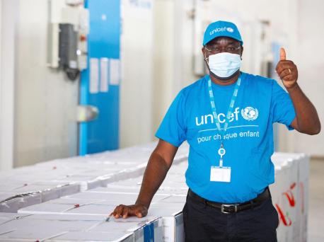 On February 26, 2021, UNICEF vaccine specialist Dr. Epa Kouacou celebrates the arrival of a shipment of COVAX COVID-19 vaccine doses in Abidjan, Côte d'Ivoire. 
