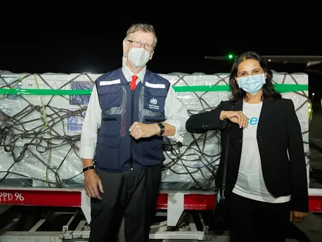 On March 3, 2021, WHO Kenya Representative Rudi Eggers (left) and UNICEF Kenya Representative Maniza Zaman receive the country's first COVID-19 vaccines from the COVAX facility at Jomo Kenyatta International Airport in Nairobi. On March 3, 2021, WHO Kenya Representative Rudi Eggers (left) and UNICEF Kenya Representative Maniza Zaman receive the country's first COVID-19 vaccines from the COVAX facility at Jomo Kenyatta International Airport in Nairobi.