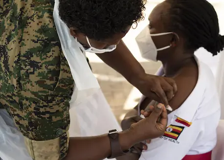 Baluka Winfred Viola, a Nursing Officer at Kisenyi Health Center IV, receives a shot of the AstraZeneca COVID-19 vaccine at Mulago National Referral Hospital during the official launch of COVID-19 vaccination in Uganda. Baluka Winfred Viola, a Nursing Officer at Kisenyi Health Center IV, receives a shot of the AstraZeneca COVID-19 vaccine at Mulago National Referral Hospital during the official launch of COVID-19 vaccination in Uganda.