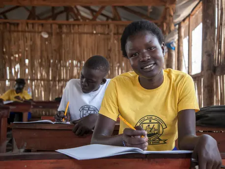 Fiifteen-year-old Martha Ajah participates in UNICEF's 'Dear Teacher' letter-writing workshop at Venus Star School in Juba, South Sudan in March 2021. Fiifteen-year-old Martha Ajah participates in UNICEF's 'Dear Teacher' letter-writing workshop at Venus Star School in Juba, South Sudan in March 2021.
