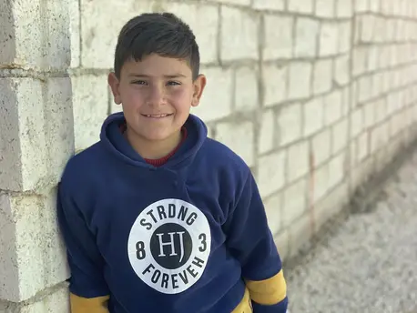 Ali, 10, is a Syrian refugee living in Mafraq, Jordan with his four brothers, two sisters and parents. Ali, 10, is a Syrian refugee living in Mafraq, Jordan with his four brothers, two sisters and parents.