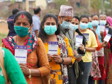 Health workers lined up to receive their second dose of COVID-19 vaccine at the Palungtar Community Health Center in Gorkha District in north-central Nepal on April 21, 2021. 