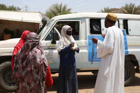People Talking Near Car