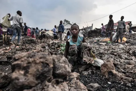 Children stand amidst lava from the volcanic eruption of Mount Nyiragongo, which occurred late on May 22, 2021 in eastern Democratic Republic of the Congo. Children stand amidst lava from the volcanic eruption of Mount Nyiragongo, which occurred late on May 22, 2021 in eastern Democratic Republic of the Congo.