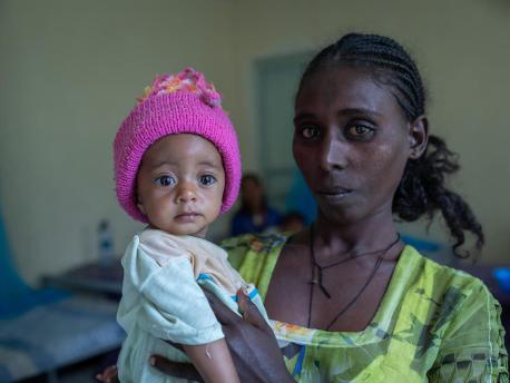 Yeshialem Gebreegziabher, 27, holds her daughter, 6-month-old Kalkidan Yeman, who is suffering from malnutrition, at Aby Adi Health Center in the Tigray region of northern Ethiopia, on June 7, 2021.