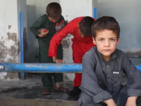 Children displaced by violence fill bottles with water near Peer Mohammad Kakar High School in Dasht-e-Padola, southern Kabul, Afghanistan on August 14, 2021. Children displaced by violence fill bottles with water near Peer Mohammad Kakar High School in Dasht-e-Padola, southern Kabul, Afghanistan on August 14, 2021.