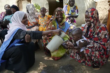 Women Washing Child
