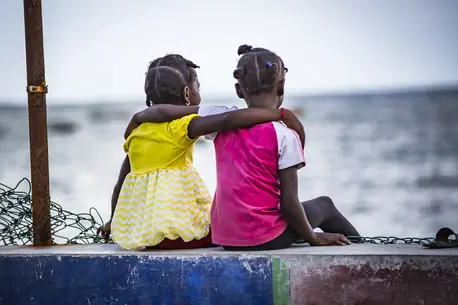 Two Girls with Arms Around Eachother
