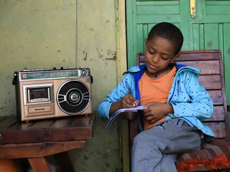 In Ethiopia, Yedidiya attends school via radio classes as part of a distance-learning program developed by the Ministry of Education with support from UNICEF. In Ethiopia, Yedidiya attends school via radio classes as part of a distance-learning program developed by the Ministry of Education with support from UNICEF.