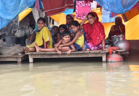 Villagers take shelter in a flooded area of Morigaon district, Assam State, India. 