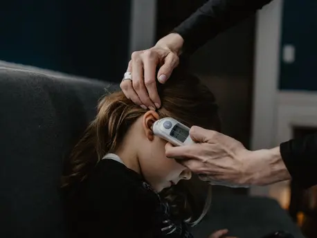 Girl Getting Temperature Taken