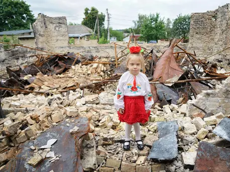 Lyuda stands amid the rubble of her school in Horenka, a small village in the Kyiv region of Ukraine. The building was heavily damaged by shelling. Lyuda stands amid the rubble of her school in Horenka, a small village in the Kyiv region of Ukraine. The building was heavily damaged by shelling.
