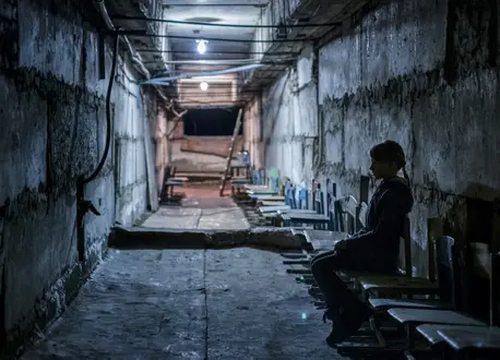 10-year-old Lera sits in the basement bomb shelter at her school in Mariinka, Donetsk Oblast, eastern Ukraine. 10-year-old Lera sits in the basement bomb shelter at her school in Mariinka, Donetsk Oblast, eastern Ukraine.