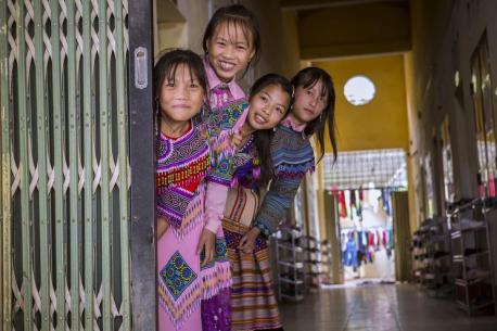 A group of Grade 7 students gather in the entryway to UNICEF-supported Sin Cheng secondary school in Vietnam.