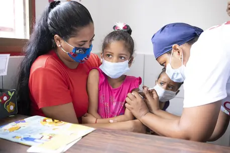 Sabrielys, 6, is vaccinated during a UNICEF-supported immunization campaign in San Vicente community, Miranda state, Venezuela. Sabrielys, 6, is vaccinated during a UNICEF-supported immunization campaign in San Vicente community, Miranda state, Venezuela.