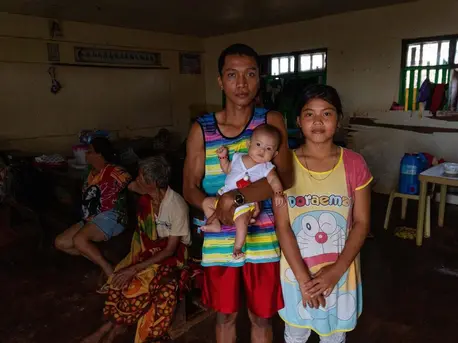 Nicole Angela Cariño, 17, her husband, Mike De Jesus, and their 3-month-old baby, Alia, set up housekeeping in a school classroom with several other families after Typhoon Rai hit Dinagat Island, the Philippines on December 16, 2021. Nicole Angela Cariño, 17, her husband, Mike De Jesus, and their 3-month-old baby, Alia, set up housekeeping in a school classroom with several other families after Typhoon Rai hit Dinagat Island, the Philippines on December 16, 2021.