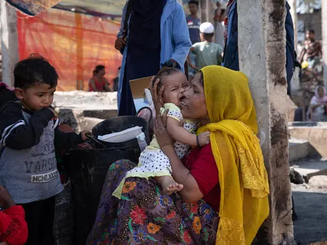 Rohingya refugee Tahrim consoles her infant daughter after their shelter was destroyed in a fire on January 9, 2022 in Cox's Bazar, Bangladesh. Rohingya refugee Tahrim consoles her infant daughter after their shelter was destroyed in a fire on January 9, 2022 in Cox's Bazar, Bangladesh.