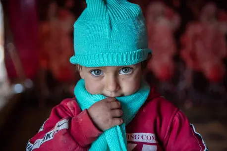 UNICEF winter clothes protect Syrian kids from the cold, like this little girl who lives in a tent. UNICEF winter clothes protect Syrian kids from the cold, like this little girl who lives in a tent.