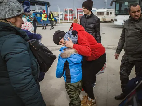 Newly arrived from Ukraine, a mother comforts her son at the border checkpoint in Isaccea, Romania on March 4, 2022. Newly arrived from Ukraine, a mother comforts her son at the border checkpoint in Isaccea, Romania on March 4, 2022.