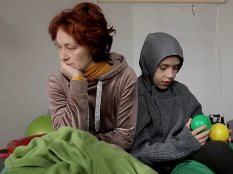 Svitlana and her son Petro, who has a severe form of autism, at the UNICEF-supported Start Center for displaced children with special needs and their families in Lviv, Ukraine. Svitlana and her son Petro, who has a severe form of autism, at the UNICEF-supported Start Center for displaced children with special needs and their families in Lviv, Ukraine.