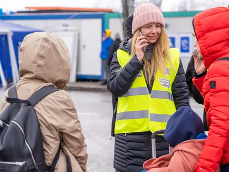 Anastasia, a refugee from Ukraine, volunteers as a translator for newly arrived families at a UNICEF Blue Dot center in Siret, Romania. Anastasia, a refugee from Ukraine, volunteers as a translator for newly arrived families at a UNICEF Blue Dot center in Siret, Romania.