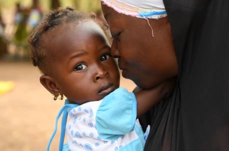 A mother and child attend a malnutrition screening session in the village of Ngolo, northern Burkina Faso.