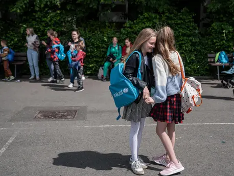 School Girls Hugging on Playground