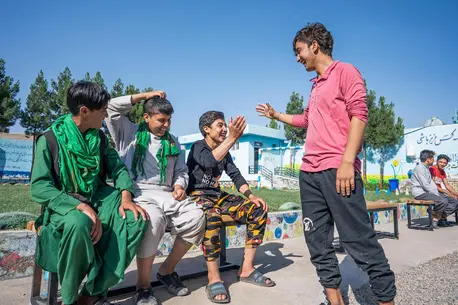 Adolescent boys who are returning migrant workers greet each other at the UNICEF-supported Gazargah Transit Center in Herat, Afghanistan. Adolescent boys who are returning migrant workers greet each other at the UNICEF-supported Gazargah Transit Center in Herat, Afghanistan.