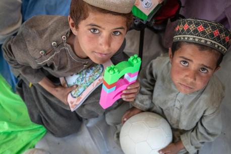 Abdul, 8, and Zolgi, 7, play with blocks and balls in a UNICEF-supported Child-Friendly Space in Gayan district, Paktika province, Afghanistan.