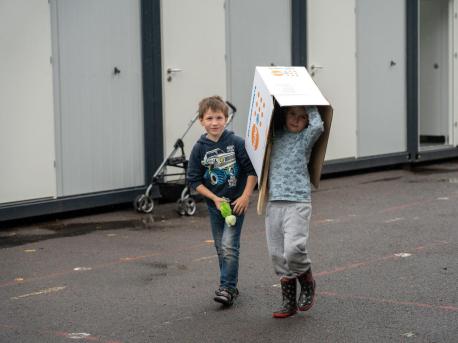 Children Walking with Box Over Head
