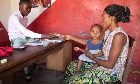 Pauline of Manono, Tangayika province, DRC, receives cash support from UNICEF. Pauline of Manono, Tangayika province, DRC, receives cash support from UNICEF.