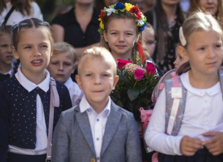 Seven-year-old Emilia, from Irpin, Ukraine, wore flowers in her hair on the first day of school at Januscz Korczak School #12 in Krakow, Poland on Sept. 1, 2022.