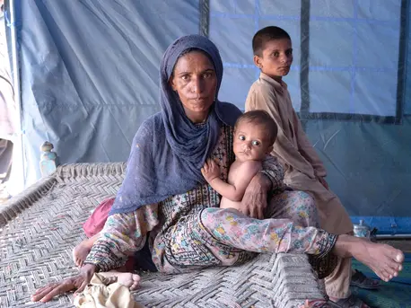 Rising floodwaters forced Nazira and her children out of their home in Balochistan Province, Pakistan. Rising floodwaters forced Nazira and her children out of their home in Balochistan Province, Pakistan.