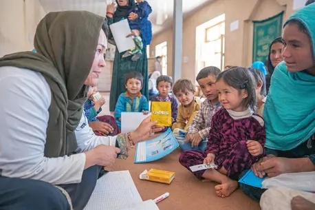Fatima Adeli, a doctor with a UNICEF-supported mobile health and nutrition team, counsels children and mothers in Safeedi-Mish village in the Nili district of Daikundi Province, central Afghanistan, on Oct. 3, 2022. Fatima Adeli, a doctor with a UNICEF-supported mobile health and nutrition team, counsels children and mothers in Safeedi-Mish village in the Nili district of Daikundi Province, central Afghanistan, on Oct. 3, 2022.