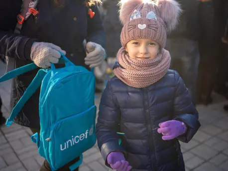 On Dec. 20, 2022, a Ukrainian child receives a UNICEF backpack at the Sloviansk rail station in the Kramatorsk district of Ukraine's Donetsk Oblast. On Dec. 20, 2022, a Ukrainian child receives a UNICEF backpack at the Sloviansk rail station in the Kramatorsk district of Ukraine's Donetsk Oblast.