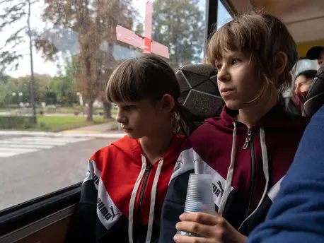 Sisters Anya, 10, left, and Polina, 11, evacuate their home in eastern Ukraine with their mother and siblings. Sisters Anya, 10, left, and Polina, 11, evacuate their home in eastern Ukraine with their mother and siblings.