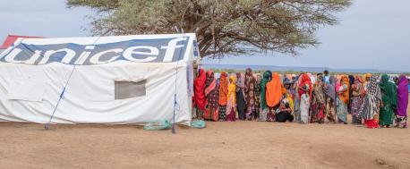 Women and children queue for health and nutrition services from UNICEF and partners at the Higlo site for displaced families in Ethiopia.