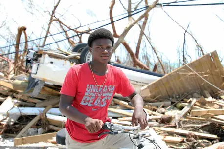 On 6 September 2019, Benson Etienne, 15, rides his bicycle around the hurricane-hit Marsh Harbour, in Abaco Island. He was with his family in a two-story building when Hurricane Dorian slammed Abaco Island for 40 hours. “Now everything is destroyed, every On 6 September 2019, Benson Etienne, 15, rides his bicycle around the hurricane-hit Marsh Harbour, in Abaco Island. He was with his family in a two-story building when Hurricane Dorian slammed Abaco Island for 40 hours. “Now everything is destroyed, every