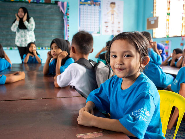 Janna, 9, attends her Grade 1 class at Sultan Disomimba Elementary School, close to the city of Marawi, in the Philippines. UNICEF has provided learning materials and other supplies to the school to help staff cope with the additional numbers of pupils and the crowded classrooms, and to keep the children in school and learning.