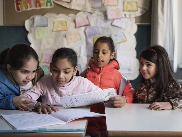 Nine-year-old Syrian refugee Badiaa (second left) sits at a desk with Italian and Syrian friends in her classroom at a public elementary school in Trento, Trentino province, Italy, Tuesday 2 May 2017. Badiaa, who is originally from Homs, Syria, arrived from Lebanon through a UNICEF-supported humanitarian corridor that helped 93 Syrian refugees reach Italy safely in February 2016.