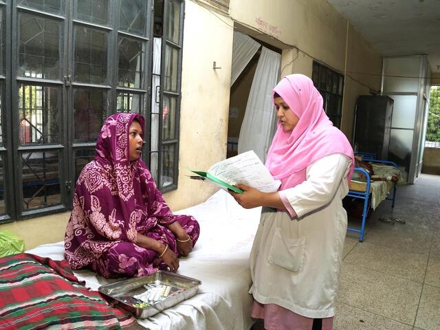 Razia Sultana Tania, a midwife in rural Bangladesh with specialized training supported by UNICEF, consults with a patient.