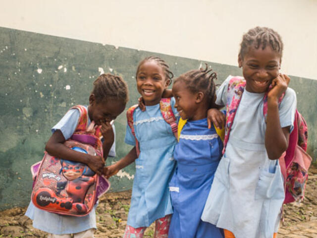 On 8 December 2020 in Sao Tome, Sao Tomé e Principe, a group of schoolgirls laugh on their way to school. ©UNICEF/UN0418198/Tremeau